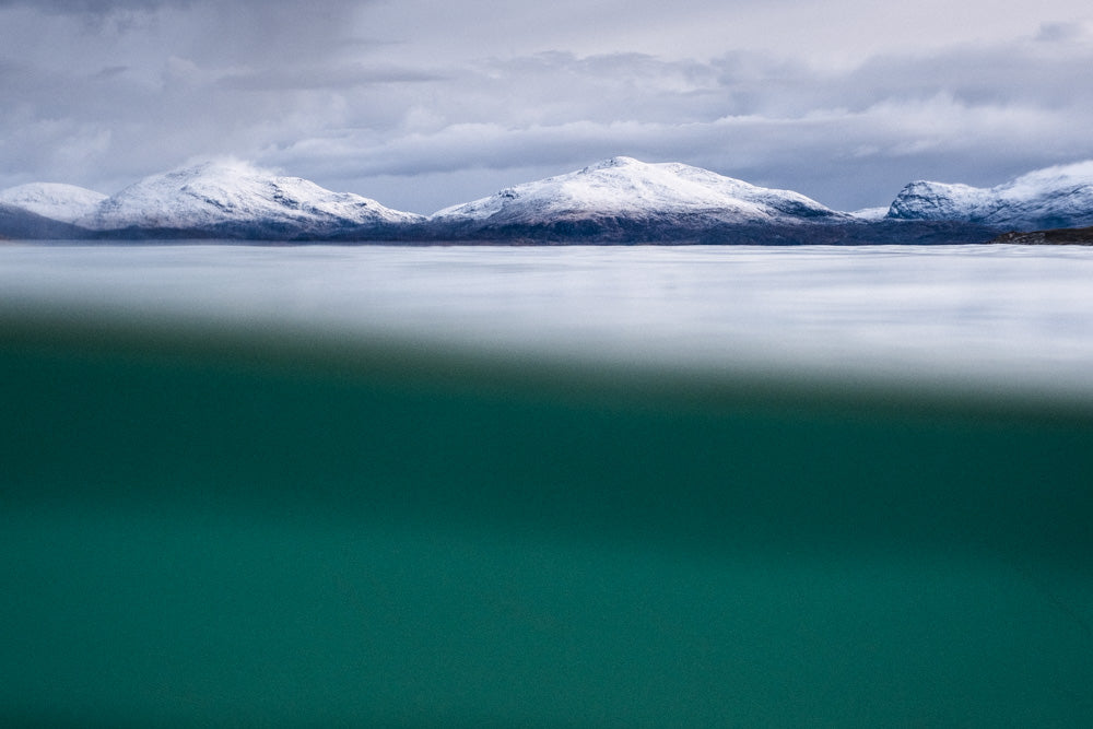Snow on hills from Underwater at Horgabost, Isle of Harris - Photographic print