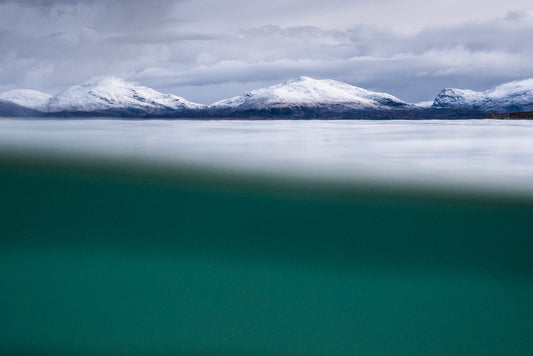 Snow on hills from Underwater at Horgabost, Isle of Harris -  Photographic print
