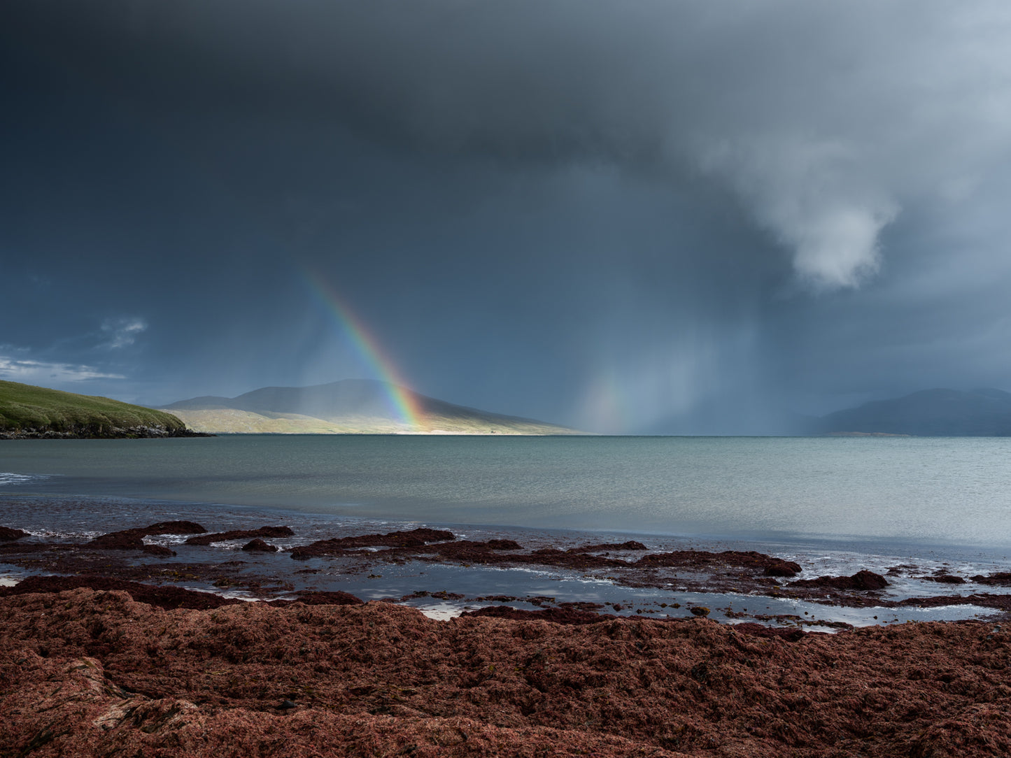 Rainbow and storm clouds over Horgabost, Isle of Harris - Photographic Print